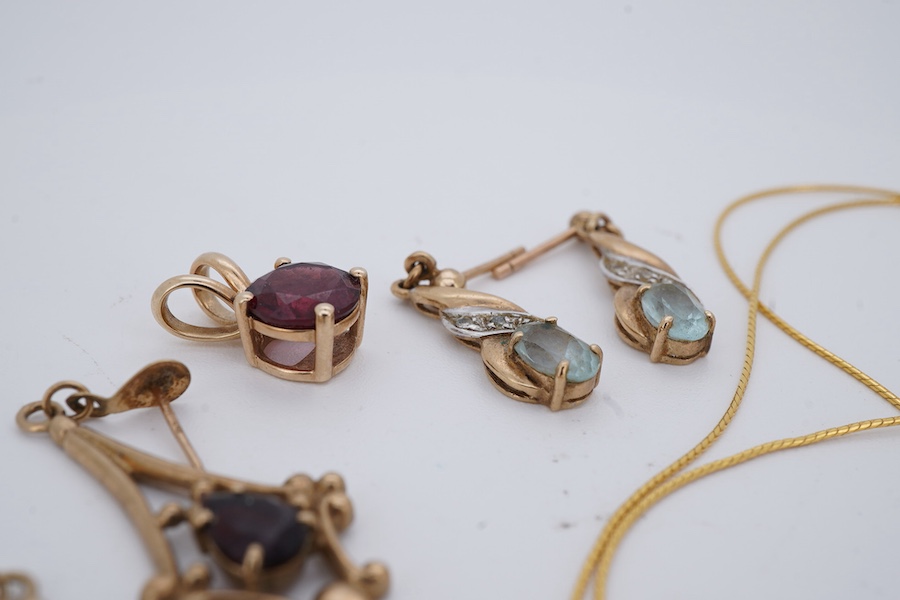 A group of jewels, comprising: a pair of garnet drop earrings; and a broken gold chain, each in 9ct gold, both with British hallmarks; a garnet pendant; and a pair of blue topaz and diamond earrings, each mounted in gold